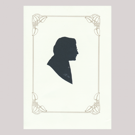 
        Front of silhouette, with man in frame looking right, wearing glasses.